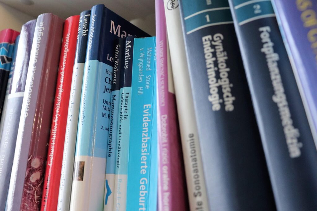books, bookshelf, textbooks, medical books, gynecology, obstetrics, evidence-based medicine, german language, croatian language, study, close-up, education, science, healthcare, academic, university, learning, research, medicine, gynecological, endocrinology, fertility, sonography, clinical knowledge, professional library